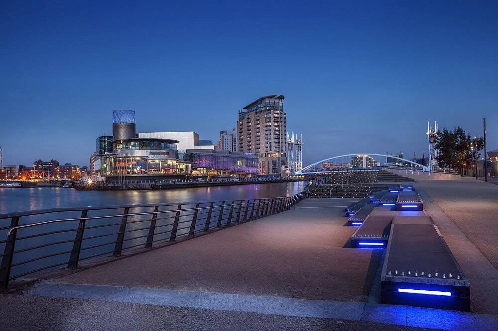 manchester city skyline at night by the river manchester city skyline at night by the river