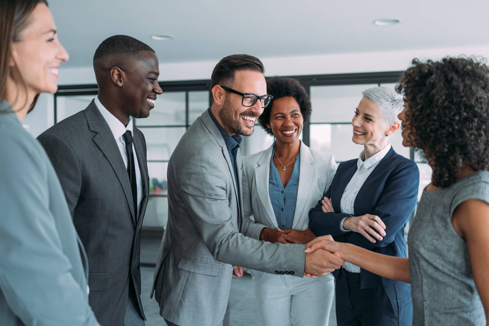 Group of people shaking hands